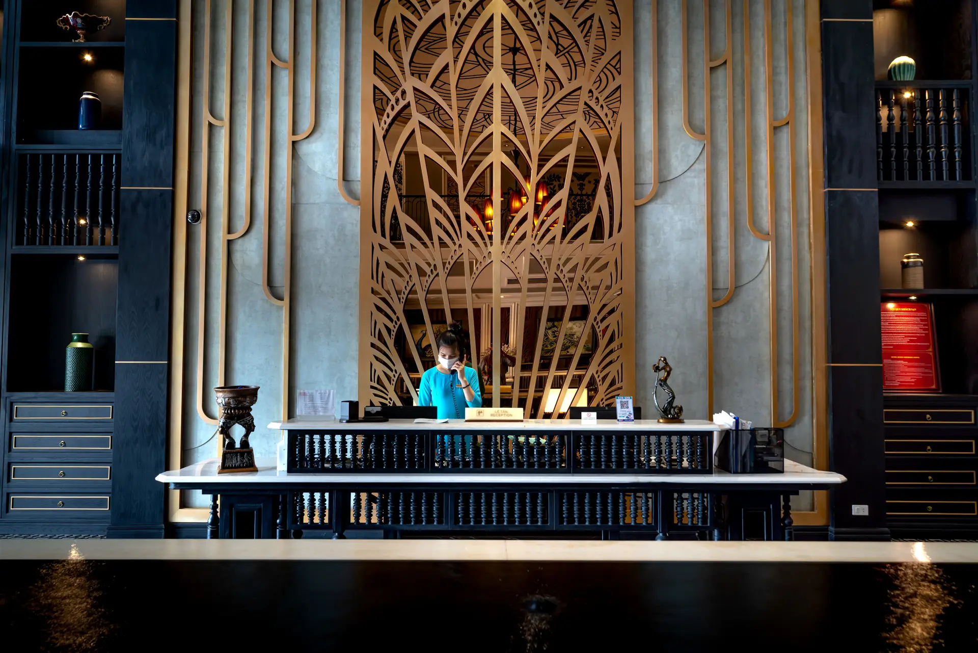 Professional hotel reception staff providing assistance