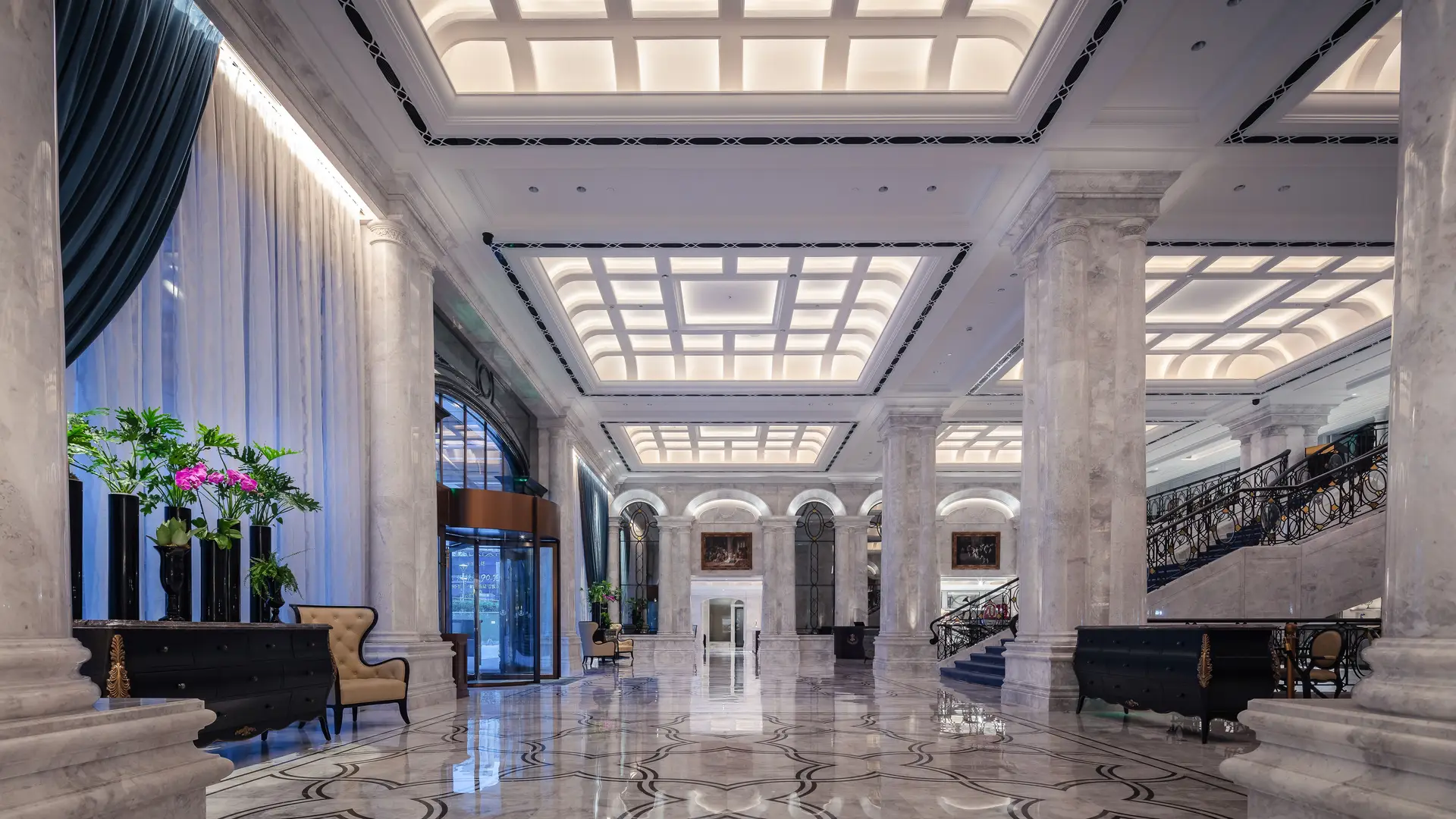Elegant hotel foyer with grand columns and sophisticated lighting