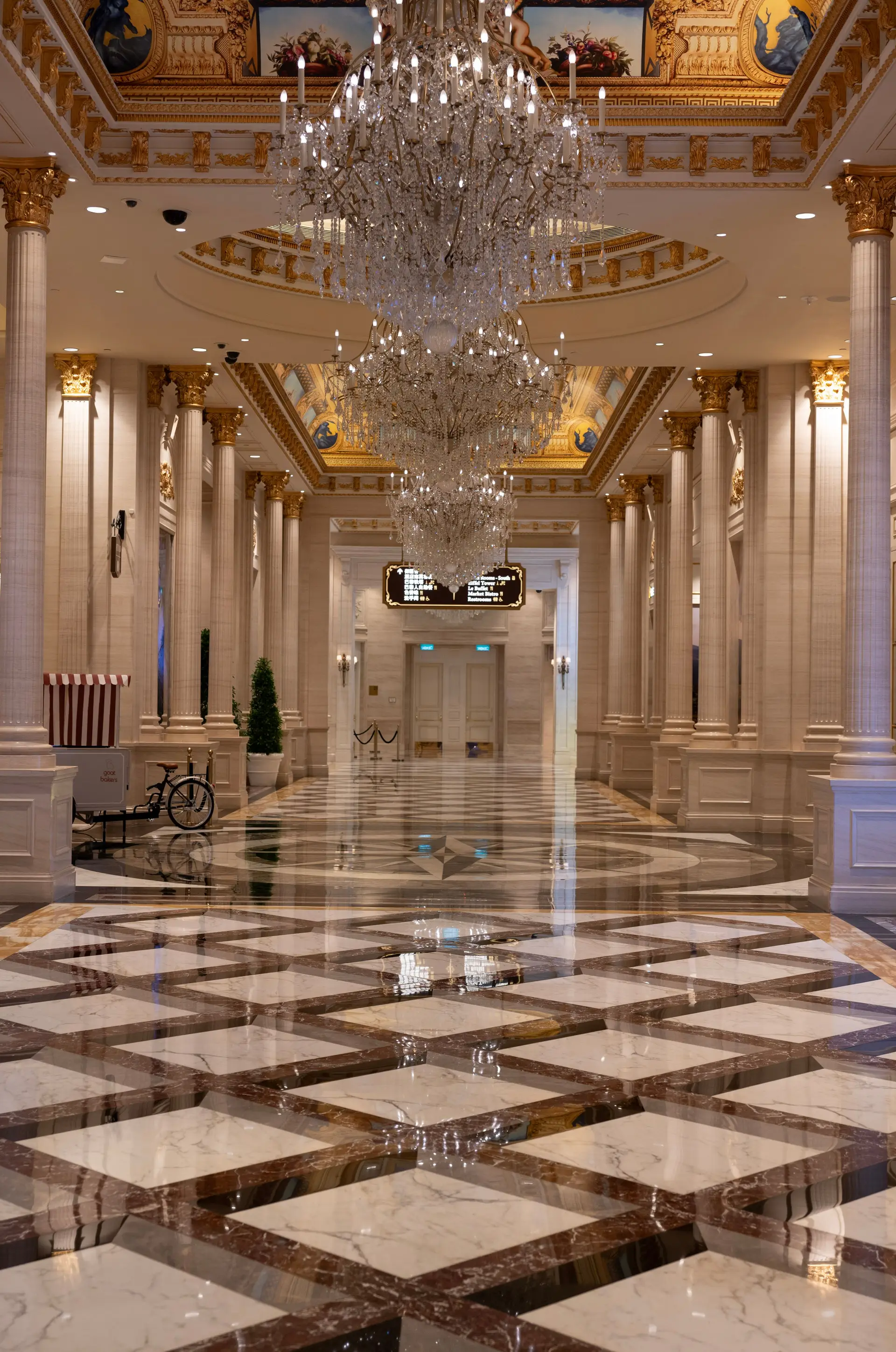 Elegant hall with chandeliers and marble flooring in a luxury resort